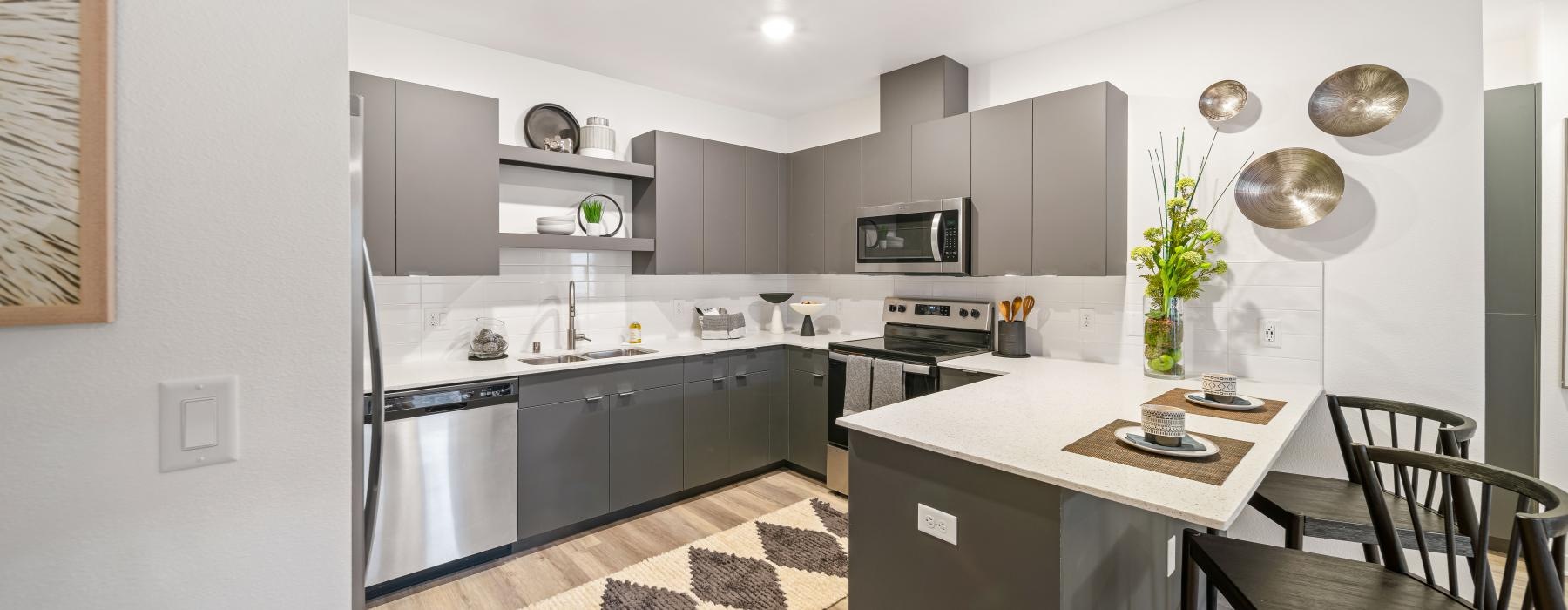 a kitchen with black appliances