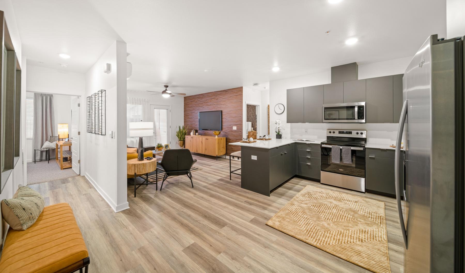 a large kitchen with a wood floor
