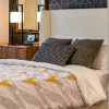 a bed with a laptop on it