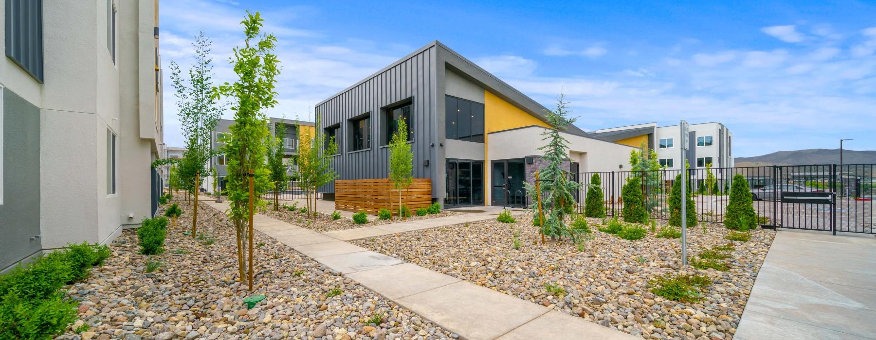 a building with a gravel path